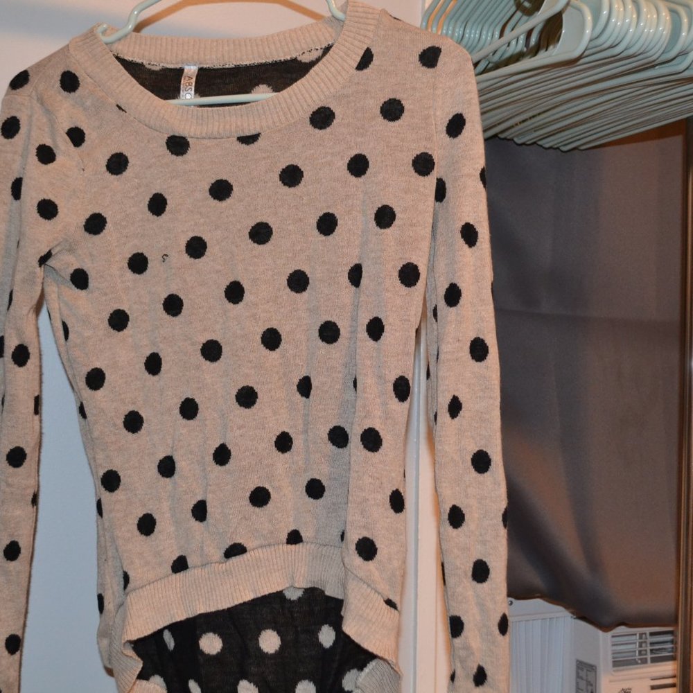 Absolutely tan long sleeve black polka dot shirt.